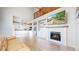 Open-concept living area with a fireplace, built-ins, and seamless access to the kitchen at 3717 Desert Ridge Cir, Castle Rock, CO 80108