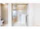 Bathroom shower featuring glass doors, tile surround, and a showerhead at 3717 Desert Ridge Cir, Castle Rock, CO 80108