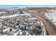 Community featuring modern homes, well-maintained streets, and snow capped mountains in the background at 3438 Cade Ct, Castle Rock, CO 80104