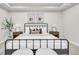Modern bedroom features a sleek metal bed frame with white linens and matching nightstands at 3438 Cade Ct, Castle Rock, CO 80104