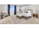 This bedroom boasts natural light, a cozy chair, a comfortable bed and stylish decor for a relaxing retreat at 3438 Cade Ct, Castle Rock, CO 80104
