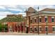 Charming brick building with architectural details, street view, and mountain backdrop at 3438 Cade Ct, Castle Rock, CO 80104