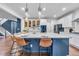 Spacious kitchen featuring a large center island, stylish pendant lights, and open access to the living areas at 3438 Cade Ct, Castle Rock, CO 80104