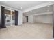 Large living space with sliding glass door to patio, neutral carpet and modern recessed lighting overhead at 3438 Cade Ct, Castle Rock, CO 80104