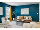 Cozy living room with stylish decor, and large window overlooking the outside at 3438 Cade Ct, Castle Rock, CO 80104