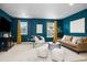 Stylish living room featuring modern furniture, soft decor, and carpet flooring at 3438 Cade Ct, Castle Rock, CO 80104