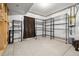 Functional unfinished storage room with open wire shelving provides ample organizational space in a basement at 3438 Cade Ct, Castle Rock, CO 80104