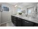 Double vanity bathroom with granite countertop and large mirror at 2584 Meadows Blvd # E, Castle Rock, CO 80109