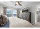 Bedroom with dresser and large TV at 2584 Meadows Blvd # E, Castle Rock, CO 80109