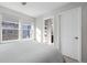 Bedroom with ensuite bathroom access and built-in shelving at 2584 Meadows Blvd # E, Castle Rock, CO 80109