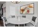 Elegant dining area with round table and gray cushioned chairs at 2584 Meadows Blvd # E, Castle Rock, CO 80109