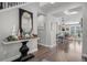 Open entryway looking into living room with hardwood floors at 2584 Meadows Blvd # E, Castle Rock, CO 80109