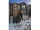 Modern three-story townhome with stone accents and private deck at 2584 Meadows Blvd # E, Castle Rock, CO 80109