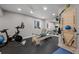 Well-equipped home gym featuring exercise bike and pilates reformer at 2584 Meadows Blvd # E, Castle Rock, CO 80109