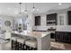 Modern kitchen with granite island and stainless steel appliances at 2584 Meadows Blvd # E, Castle Rock, CO 80109