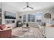 Bright and spacious living room with fireplace and large windows at 2584 Meadows Blvd # E, Castle Rock, CO 80109