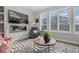 Relaxing living room featuring a fireplace and large windows at 2584 Meadows Blvd # E, Castle Rock, CO 80109