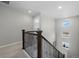 Upstairs hall with staircase and multiple windows at 2584 Meadows Blvd # E, Castle Rock, CO 80109