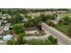Aerial view of cozy home surrounded by green trees in a quiet neighborhood at 205 Beech St, Hudson, CO 80642