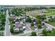 Wide aerial view of quiet neighborhood with tree-lined streets and well-kept homes at 205 Beech St, Hudson, CO 80642