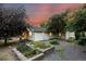 The tranquil backyard retreat includes lovely landscaping and garden beds, providing a serene outdoor living space at 205 Beech St, Hudson, CO 80642