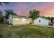 Exterior of home and detached garage showing the back yard with lawn at 205 Beech St, Hudson, CO 80642