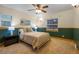 Cozy bedroom featuring neutral tones, complemented by a charming ceiling fan and natural light at 205 Beech St, Hudson, CO 80642