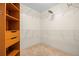 Walk-in closet with carpeted floor, wire shelving, and additional drawers on the side at 205 Beech St, Hudson, CO 80642