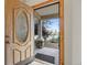 Elegant front door with decorative glass, framed by stonework and a covered porch, welcomes you home at 205 Beech St, Hudson, CO 80642
