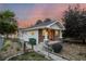 Charming exterior of a home with stone accents and a well-manicured front yard at 205 Beech St, Hudson, CO 80642