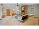 Bright living room featuring a stone fireplace, plush seating area, and open layout at 205 Beech St, Hudson, CO 80642