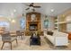 Inviting living room with stone fireplace, vaulted ceilings, and neutral color scheme at 205 Beech St, Hudson, CO 80642