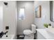 Modern bathroom features a shower, toilet, and vanity with contemporary fixtures at 6839 E 21St Ave, Denver, CO 80207