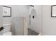 Modern bathroom featuring a stand up shower with marble tiling and matte black hardware at 6839 E 21St Ave, Denver, CO 80207