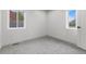 This bedroom has two windows offering ample sunlight and neutral-colored carpet at 6839 E 21St Ave, Denver, CO 80207