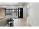 Open living area with large windows, modern furniture, and hardwood floors at 6839 E 21St Ave, Denver, CO 80207