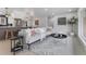 Open-concept living space with modern furniture, decor, and seamless transition to the kitchen at 6839 E 21St Ave, Denver, CO 80207