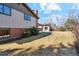 A grassy backyard features a shed and trees at 10121 W 70Th Dr, Arvada, CO 80004