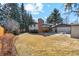 Large backyard featuring a shed and covered patio with outdoor seating at 10121 W 70Th Dr, Arvada, CO 80004