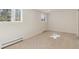 Spacious bedroom with neutral carpet, trim, and two bright windows at 10121 W 70Th Dr, Arvada, CO 80004