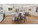 Bright, updated kitchen with white cabinets, stainless steel appliances, and a large quartz countertop island at 10121 W 70Th Dr, Arvada, CO 80004