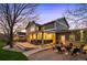 Backyard patio with comfortable seating, outdoor heaters, and a cozy fire pit area at 15946 W Ellsworth Ln, Golden, CO 80401