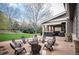 Outdoor patio with firepit and plenty of seating for entertaining at 15946 W Ellsworth Ln, Golden, CO 80401