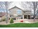 View of the backyard featuring outdoor seating, patio, and lush lawn at 15946 W Ellsworth Ln, Golden, CO 80401