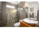 Modern bathroom boasts sleek vessel sink, glass-enclosed shower, and stylish tile work at 15946 W Ellsworth Ln, Golden, CO 80401