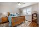 Comfortable bedroom with a plush rug and bright, sunny window at 15946 W Ellsworth Ln, Golden, CO 80401