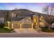 Beautiful two-story home with a three-car garage, brick accents, and landscaped front yard at 15946 W Ellsworth Ln, Golden, CO 80401