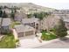 Aerial view of a stunning home with a three-car garage and mountain views at 15946 W Ellsworth Ln, Golden, CO 80401