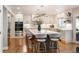 Modern kitchen featuring stainless steel appliances, an expansive center island, and ample cabinet space at 15946 W Ellsworth Ln, Golden, CO 80401