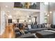 Large living room with hardwood floors, a view to the kitchen, and an open, airy layout at 15946 W Ellsworth Ln, Golden, CO 80401